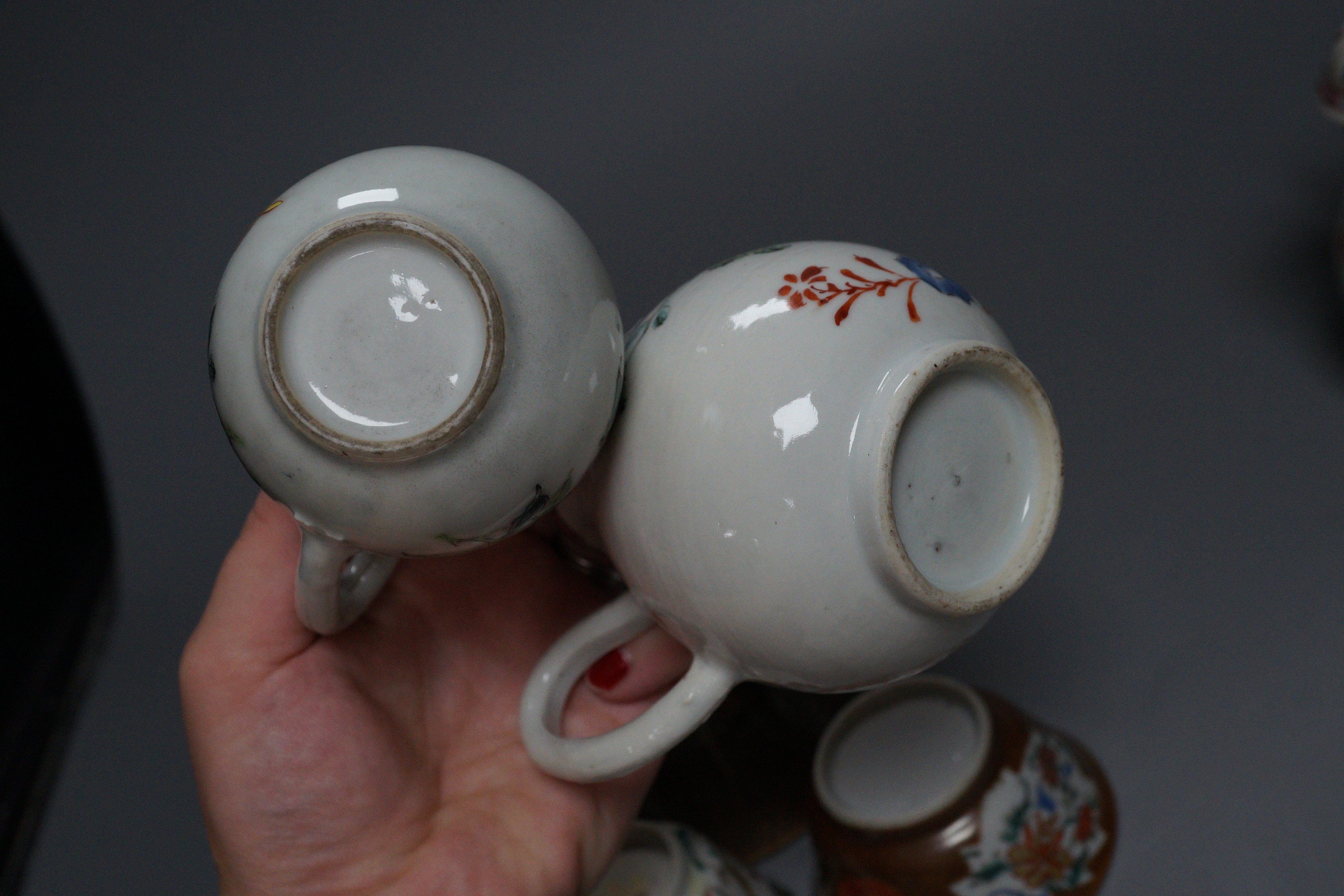 Three Chinese export famille rose cream jugs, one with pierced cover and three small bowls, 18th century and later